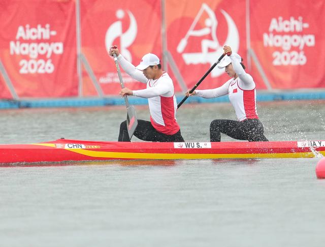 (260926) -- NAGOYA, Sept. 26, 2026 (Xinhua) -- Wu Shengyue (L)/Ma Yanan of China compete during the mixed canoe double 500m final of canoe sprint at the 20th Asian Games Aichi-Nagoya 2026 in Miyoshi of Aichi Prefecture, Japan, Sept. 26, 2026. (Xinhua/Zhang Haobo)