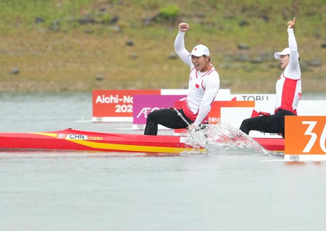 (260926) -- NAGOYA, Sept. 26, 2026 (Xinhua) -- Wu Shengyue (L)/Ma Yanan of China celebrate as they cross the finish line during the mixed canoe double 500m final of canoe sprint at the 20th Asian Games Aichi-Nagoya 2026 in Miyoshi of Aichi Prefecture, Japan, Sept. 26, 2026. (Xinhua/Zhang Haobo)