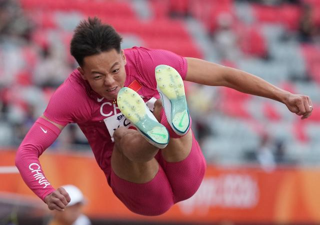 (260926) -- NAGOYA, Sept. 26, 2026 (Xinhua) -- Chen Xinghua of China competes during the men's decathlon long jump of athletics at the 20th Asian Games Aichi-Nagoya 2026 in Nagoya, Japan, Sept. 26, 2026. (Xinhua/Luo Yuan)