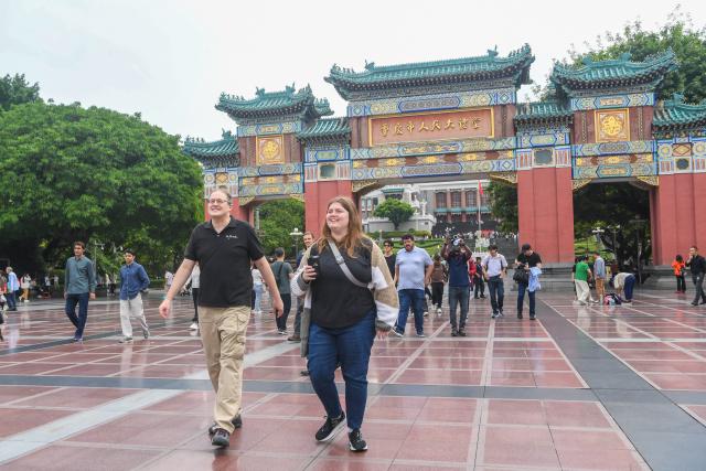 (260927) -- CHONGQING, Sept. 27, 2026 (Xinhua) -- Francis Stonier (L, front) and his colleagues walk in front of the People's Great Hall of Chongqing in southwest China's Chongqing Municipality, Sept. 19, 2026.
  Since arriving in Chongqing in 2019 to take up a teaching post, U.S. scholar Francis Stonier has become a well-known local figure. Over the past few years, he has devoted himself to promoting STEAM (Science, Technology, Engineering, Arts, Mathematics) interdisciplinary education and free science outreach for rural school students.
  Currently a professor at Southwest University, Stonier teaches academic writing to international students. Beyond his university lectures, Stonier brings science to life for primary and secondary school students. He simplifies complex concepts, tailoring them for young children. 
  To make science more accessible, Stonier has developed personalized STEAM curricula. Using 3D printing and LEGO bricks, he transforms complex academic concepts into hands-on experiments, encouraging students to explore science through creation and teamwork. In a creative lesson at Bashu Primary School in Chongqing, Stonier used everyday items to simulate birds' foraging behaviors, helping kids understand natural science through play. 
  Since 2019, Stonier has visited nearly 80 primary and secondary schools across Chongqing, including those in remote rural areas, to give free science lessons. 
  Stonier's grassroots teaching experience has also reshaped his understanding of education. He speaks highly of Chinese educators' openness to practical and innovative teaching approaches. 
  Stonier has witnessed Chongqing's development. He has fully immersed himself in local life. Moved by the warmth of the Chongqing people, and the city's unique charm and diverse cuisine, Stonier regards Chongqing as his second hometown, praising its harmonious balance of urban convenience and natural scenery. (Xinhua/Tang Yi)