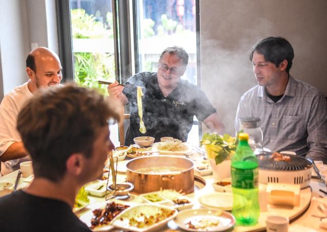 (260927) -- CHONGQING, Sept. 27, 2026 (Xinhua) -- Francis Stonier (2nd R) has a meal with colleagues in southwest China's Chongqing Municipality, Sept. 19, 2026.
  Since arriving in Chongqing in 2019 to take up a teaching post, U.S. scholar Francis Stonier has become a well-known local figure. Over the past few years, he has devoted himself to promoting STEAM (Science, Technology, Engineering, Arts, Mathematics) interdisciplinary education and free science outreach for rural school students.
  Currently a professor at Southwest University, Stonier teaches academic writing to international students. Beyond his university lectures, Stonier brings science to life for primary and secondary school students. He simplifies complex concepts, tailoring them for young children. 
  To make science more accessible, Stonier has developed personalized STEAM curricula. Using 3D printing and LEGO bricks, he transforms complex academic concepts into hands-on experiments, encouraging students to explore science through creation and teamwork. In a creative lesson at Bashu Primary School in Chongqing, Stonier used everyday items to simulate birds' foraging behaviors, helping kids understand natural science through play. 
  Since 2019, Stonier has visited nearly 80 primary and secondary schools across Chongqing, including those in remote rural areas, to give free science lessons. 
  Stonier's grassroots teaching experience has also reshaped his understanding of education. He speaks highly of Chinese educators' openness to practical and innovative teaching approaches. 
  Stonier has witnessed Chongqing's development. He has fully immersed himself in local life. Moved by the warmth of the Chongqing people, and the city's unique charm and diverse cuisine, Stonier regards Chongqing as his second hometown, praising its harmonious balance of urban convenience and natural scenery. (Xinhua/Tang Yi)