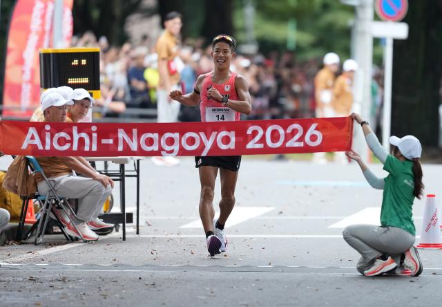 (260927) -- NAGOYA, Sept. 27, 2026 (Xinhua) -- Katsuki Hayato of Japan crosses the finish line during the men's marathon race walk final of Athletics at the 20th Asian Games Aichi-Nagoya 2026 in Nagoya, Japan, Sept. 27, 2026. (Xinhua/Luo Yuan)