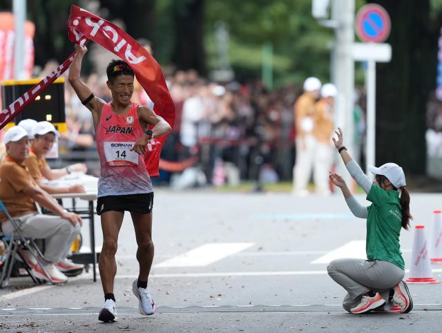 (260927) -- NAGOYA, Sept. 27, 2026 (Xinhua) -- Katsuki Hayato of Japan celebrates as he crosses the finish line during the men's marathon race walk final of Athletics at the 20th Asian Games Aichi-Nagoya 2026 in Nagoya, Japan, Sept. 27, 2026. (Xinhua/Luo Yuan)