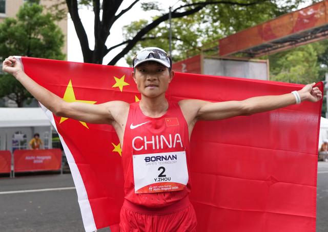 (260927) -- NAGOYA, Sept. 27, 2026 (Xinhua) -- Zhou Yingcheng of China celebrates after the men's marathon race walk final of Athletics at the 20th Asian Games Aichi-Nagoya 2026 in Nagoya, Japan, Sept. 27, 2026. (Xinhua/Jia Yuchen)