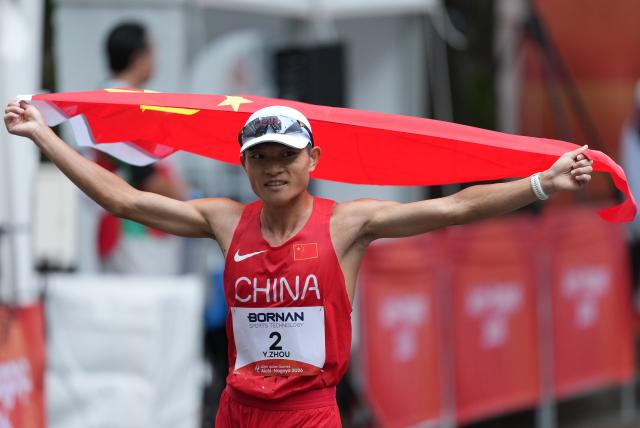(260927) -- NAGOYA, Sept. 27, 2026 (Xinhua) -- Zhou Yingcheng of China celebrates after the men's marathon race walk final of Athletics at the 20th Asian Games Aichi-Nagoya 2026 in Nagoya, Japan, Sept. 27, 2026. (Xinhua/Luo Yuan)