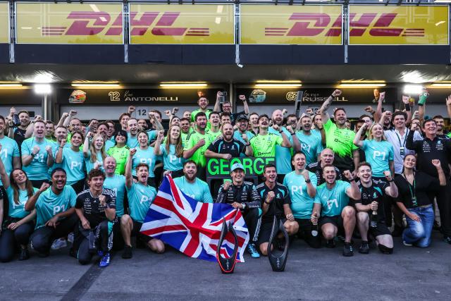 (260927) -- BAKU, Sept. 27, 2026 (Xinhua) -- Mercedes' driver George Russell (front C) of Britain celebrates his win with team members after the Formula One Azerbaijan Grand Prix at the Baku City Circuit in Baku, on Sept. 26, 2026. (Photo by Li Qixiang/Xinhua)