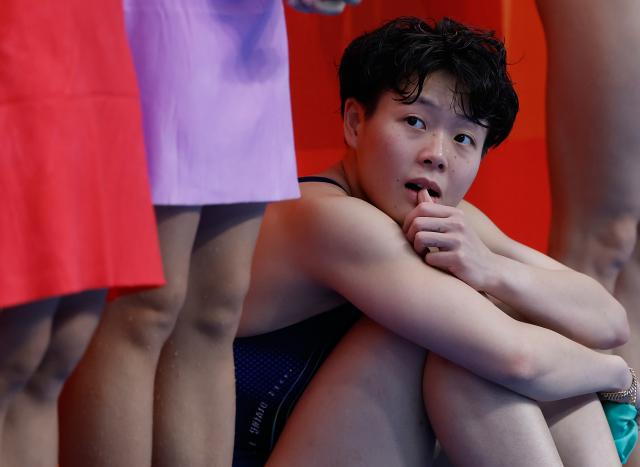 (260927) -- TOKYO, Sept. 27, 2026 (Xinhua) -- Chen Yiwen of China waits for the result after the women's synchronised 3m springboard final of diving at the 20th Asian Games Aichi-Nagoya 2026 in Tokyo, Japan, Sept. 27, 2026. (Xinhua/Wu Zhizun)