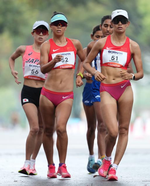 (260927) -- NAGOYA, Sept. 27, 2026 (Xinhua) -- Danzengquzong (front R) and Ma Li (front L) of China compete during the women's marathon race walk final of Athletics at the 20th Asian Games Aichi-Nagoya 2026 in Nagoya, Japan, Sept. 27, 2026. (Xinhua/Luo Yuan)