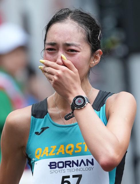 (260927) -- NAGOYA, Sept. 27, 2026 (Xinhua) -- Yasmina Toxanbayeva of Kazakhstan cries after the women's marathon race walk final of Athletics at the 20th Asian Games Aichi-Nagoya 2026 in Nagoya, Japan, Sept. 27, 2026. (Xinhua/Luo Yuan)