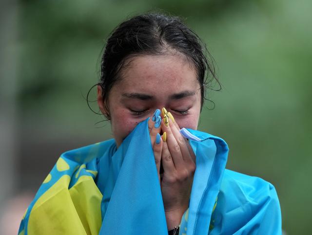 (260927) -- NAGOYA, Sept. 27, 2026 (Xinhua) -- Yasmina Toxanbayeva of Kazakhstan cries after the women's marathon race walk final of Athletics at the 20th Asian Games Aichi-Nagoya 2026 in Nagoya, Japan, Sept. 27, 2026. (Xinhua/Luo Yuan)