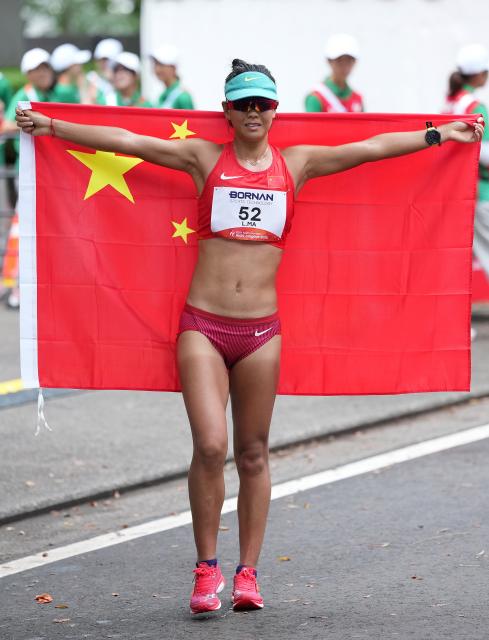 (260927) -- NAGOYA, Sept. 27, 2026 (Xinhua) -- Ma Li of China celebrates after the women's marathon race walk final of Athletics at the 20th Asian Games Aichi-Nagoya 2026 in Nagoya, Japan, Sept. 27, 2026. (Xinhua/Luo Yuan)