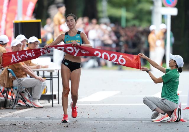 (260927) -- NAGOYA, Sept. 27, 2026 (Xinhua) -- Yasmina Toxanbayeva of Kazakhstan crosses the finish line during the women's marathon race walk final of Athletics at the 20th Asian Games Aichi-Nagoya 2026 in Nagoya, Japan, Sept. 27, 2026. (Xinhua/Luo Yuan)