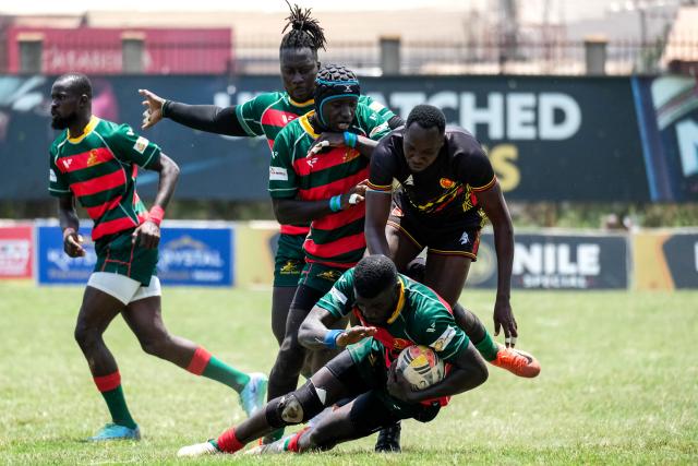 (260927) -- KAMPALA, Sept. 27, 2026 (Xinhua) -- Players of Senegal and Uganda compete for the ball during the 2026 Rugby Africa Men's Sevens Series match between Uganda and Senegal at Kyadondo Rugby Grounds in Kampala, Uganda, Sept. 26, 2026. (Photo by Hajarah Nalwadda/Xinhua)