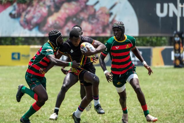 (260927) -- KAMPALA, Sept. 27, 2026 (Xinhua) -- Karim Arinaitwe (2nd L) of Uganda competes for the ball during the 2026 Rugby Africa Men's Sevens Series match between Uganda and Senegal at Kyadondo Rugby Grounds in Kampala, Uganda, Sept. 26, 2026. (Photo by Hajarah Nalwadda/Xinhua)
