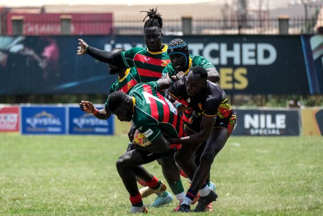 (260927) -- KAMPALA, Sept. 27, 2026 (Xinhua) -- Players of Senegal and Uganda compete for the ball during the 2026 Rugby Africa Men's Sevens Series match between Uganda and Senegal at Kyadondo Rugby Grounds in Kampala, Uganda, Sept. 26, 2026. (Photo by Hajarah Nalwadda/Xinhua)