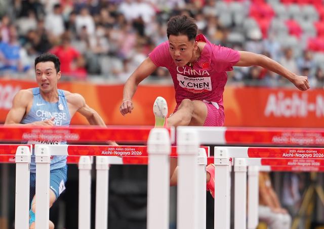 (260927) -- NAGOYA, Sept. 27, 2026 (Xinhua) -- Chen Xinghua (R) of China competes during the men's decathlon 110m hurdles of athletics at the 20th Asian Games Aichi-Nagoya 2026 in Nagoya, Japan, Sept. 27, 2026. (Xinhua/Lui Siu Wai)
