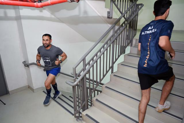 (260927) -- KUWAIT CITY, Sept. 27, 2026 (Xinhua) -- Participants take part in the Peak Race 2026 at Al Hamra Tower in Kuwait City, Kuwait, Sept. 26, 2026. More than 900 people participated in the Peak Race 2026 at Al Hamra Tower in Kuwait City on Saturday, according to the organizer. Participants climbed 60 floors of the landmark tower in the vertical race, which featured men's and women's individual events, men's and women's relay events, as well as a junior category. (Photo by Asad/Xinhua)