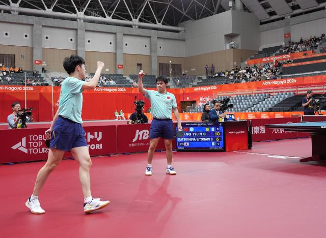 (260927) -- TOYOTA, Sept. 27, 2026 (Xinhua) -- Huang Youzheng /Lin Shidong (R) of China celebrate after winning the men's doubles semifinal table tennis match between Huang Youzheng/Lin Shidong of China and Matsushima Sora/Togami Shunsuke of Japan at the 20th Asian Games Aichi-Nagoya 2026 in Toyota of Aichi Prefecture, Japan, Sept. 27, 2026. (Xinhua/Cheong Kam Ka)