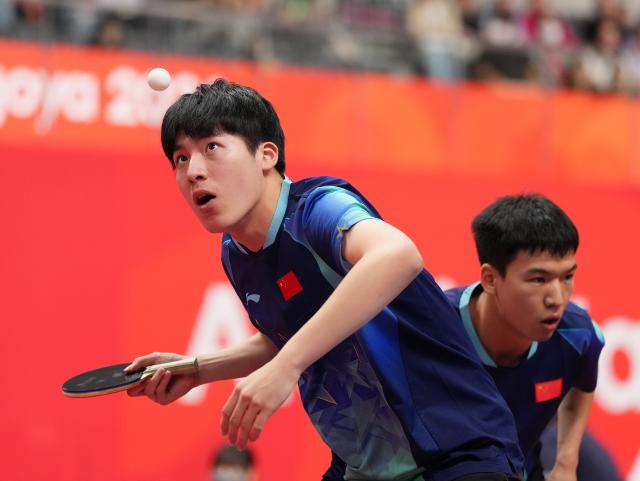 (260927) -- TOYOTA, Sept. 27, 2026 (Xinhua) -- Xiang Peng/Wen Ruibo (L) of China compete during the men's doubles semifinal table tennis match between Xiang Peng/Wen Ruibo of China and Harimoto Tomokazu/Shinozuka Hiroto of Japan at the 20th Asian Games Aichi-Nagoya 2026 in Toyota of Aichi Prefecture, Japan, Sept. 27, 2026. (Xinhua/Wang Fei)