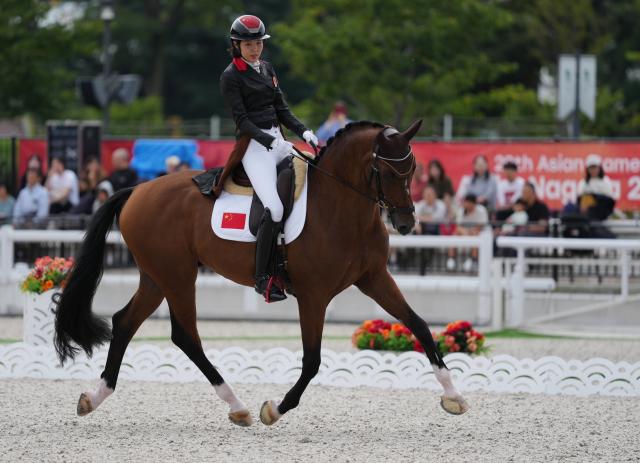 (260927) -- TOKYO, Sept. 27, 2026 (Xinhua) -- Rao Jiayi of China competes during the dressage individual final of equestrian at the 20th Asian Games Aichi-Nagoya 2026 in Tokyo, Japan, Sept. 27, 2026. (Photo by Wang Shen/Xinhua)