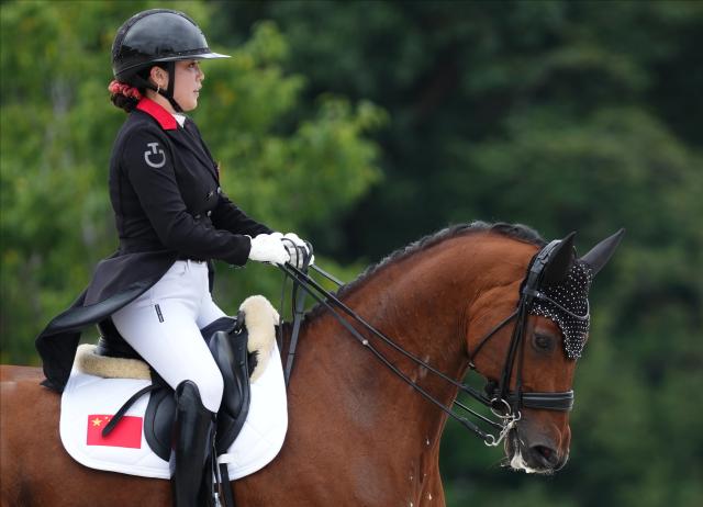 (260927) -- TOKYO, Sept. 27, 2026 (Xinhua) -- Yu Jiayi of China competes during the dressage individual final of equestrian at the 20th Asian Games Aichi-Nagoya 2026 in Tokyo, Japan, Sept. 27, 2026. (Photo by Wang Shen/Xinhua)