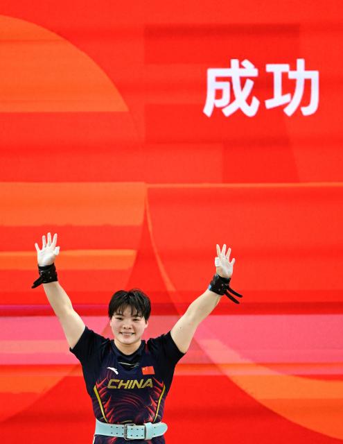 (260927) -- NAGOYA, Sept. 27, 2026 (Xinhua) -- He Renxiu of China celebrates during the women's 77kg final of weightlifting at the 20th Asian Games Aichi-Nagoya 2026 in Nagoya, Japan, Sept. 27, 2026. (Xinhua/Yu Yang)