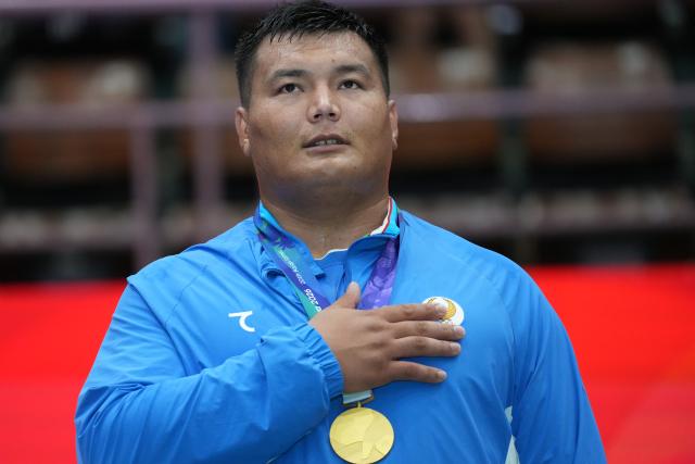 (260927) -- NAGOYA, Sept. 27, 2026 (Xinhua) -- Gold medalist Shokhrukhkhon Bakhtiyorov of Uzbekistan poses during the awarding ceremony after the men's +90kg final of Kurash at the 20th Asian Games Aichi-Nagoya 2026 in Nagoya, Japan, Sept. 27, 2026. (Xinhua/Hou Zhaokang)