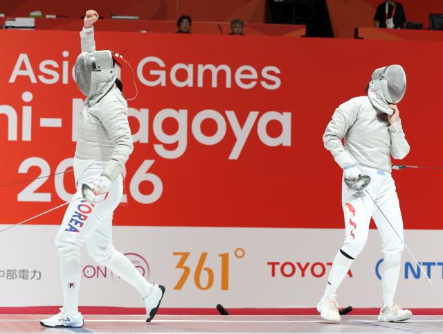 (260927) -- TOKONAME, Sept. 27, 2026 (Xinhua) -- Pan Qimiao (R) of China reacts as Jeon Hayoung of South Korea celebrates during the women's sabre team semifinal match of fencing between China and South Korea at the 20th Asian Games Aichi-Nagoya 2026 in Tokoname of Aichi Prefecture, Japan, Sept. 27, 2026. (Xinhua/Yao Qilin)