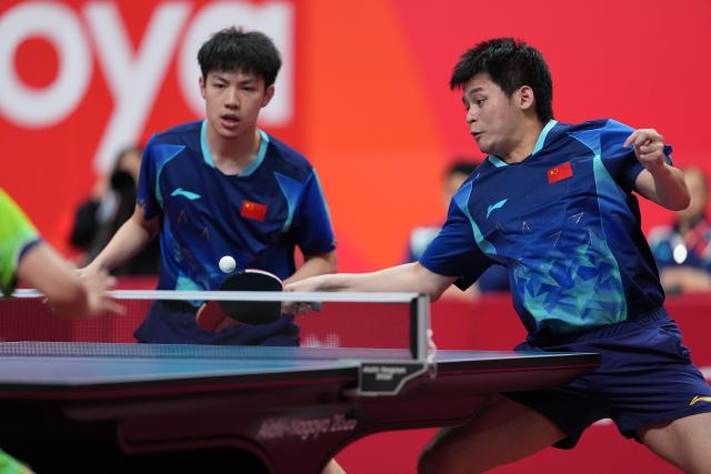 (260927) -- TOYOTA, Sept. 27, 2026 (Xinhua) -- Lin Shidong (R)/Huang Youzheng of China compete during the men's doubles final table tennis match between Lin Shidong/Huang Youzheng of China and Harimoto Tomokazu/Shinozuka Hiroto of Japan at the 20th Asian Games Aichi-Nagoya 2026 in Toyota of Aichi Prefecture, Japan, Sept. 27, 2026. (Xinhua/Cheong Kam Ka)