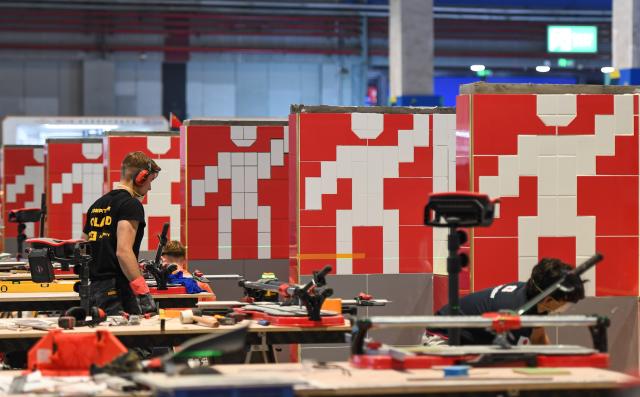 (260927) -- SHANGHAI, Sept. 27, 2026 (Xinhua) -- Competitors take part in the wall and floor tiling competition during the 48th WorldSkills Competition in Shanghai, east China, Sept. 26, 2026. Competitors from across the world showcased their skills in the competitions of construction and building technology sector, such as bricklaying, concrete construction and cabinetmaking, at the 48th WorldSkills Competition in Shanghai. (Photo by Yang Yang/Xinhua)