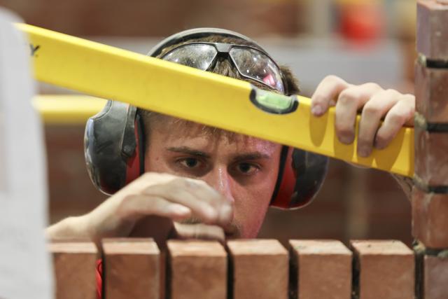 (260927) -- SHANGHAI, Sept. 27, 2026 (Xinhua) -- A competitor takes part in the bricklaying competition during the 48th WorldSkills Competition in Shanghai, east China, Sept. 25, 2026. Competitors from across the world showcased their skills in the competitions of construction and building technology sector, such as bricklaying, concrete construction and cabinetmaking, at the 48th WorldSkills Competition in Shanghai. (Xinhua/Wang Xiang)