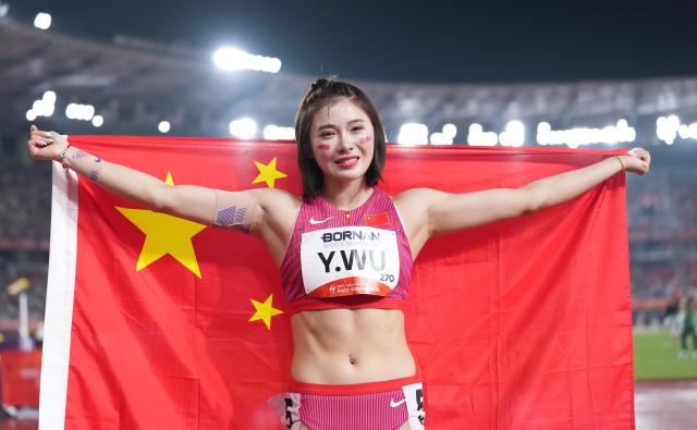 (260927) -- NAGOYA, Sept. 27, 2026 (Xinhua) -- Wu Yanni of China celebrates after the women's 100m hurdles final of Athletics at the 20th Asian Games Aichi-Nagoya 2026 in Nagoya, Japan, Sept. 27, 2026. (Xinhua/Jia Yuchen)