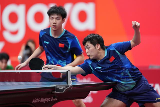 (260927) -- TOYOTA, Sept. 27, 2026 (Xinhua) -- Lin Shidong (R)/Huang Youzheng compete during the men's doubles final table tennis match between Lin Shidong/Huang Youzheng of China and Harimoto Tomokazu/Shinozuka Hiroto of Japan at the 20th Asian Games Aichi-Nagoya 2026 in Toyota of Aichi Prefecture, Japan, Sept. 27, 2026. (Photo by Cheong Kam Ka/Xinhua)