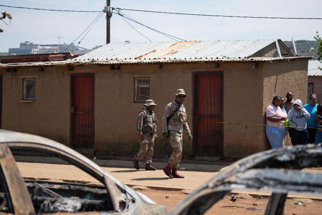 (260927) -- WEDELA, Sept. 27, 2026 (Xinhua) -- People work at the scene of a shooting incident in the mining township of Wedela in Gauteng Province, South Africa, Sept. 27, 2026. Seventeen people were killed Saturday night in a bar shooting in the mining township of Wedela in South Africa, local media reported on Sunday. (Photo by Rumana Akoob/Xinhua)