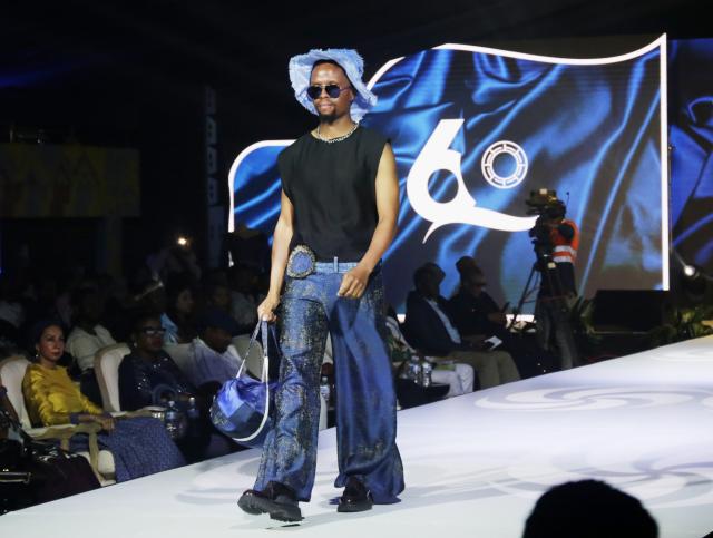 (260927) -- GABORONE, Sept. 27, 2026 (Xinhua) -- A model presents creations during the national independence fashion show at the historic Main Mall in Gaborone, Botswana, Sept. 26, 2026. The fashion show was held here on Saturday night as one of the events to mark the 60th anniversary of Botswana's independence. (Xinhua/Tshekiso Tebalo)