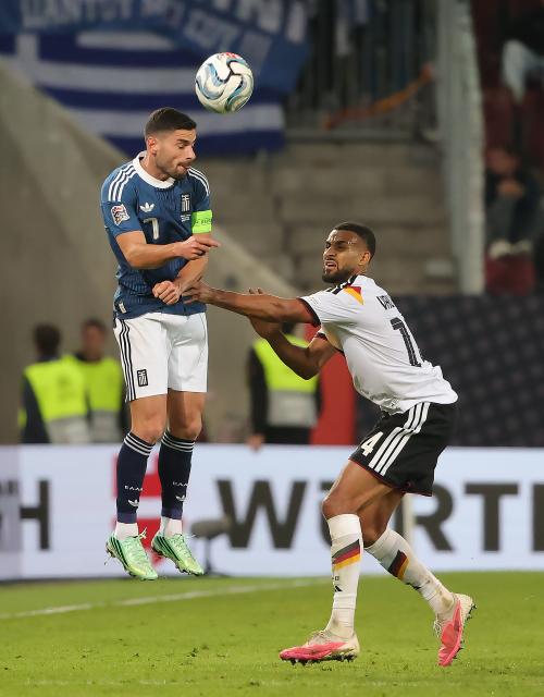 (260928) -- AUGSBURG, Sept. 28, 2026 (Xinhua) -- Josha Vagnoman (R) of Germany vies with Giorgos Masouras of Greece during the UEFA Nations League 2026/27 League A Group A match between Germany and Greece in Augsburg, Germany, Sept. 27, 2026. (Photo by Philippe Ruiz/Xinhua)