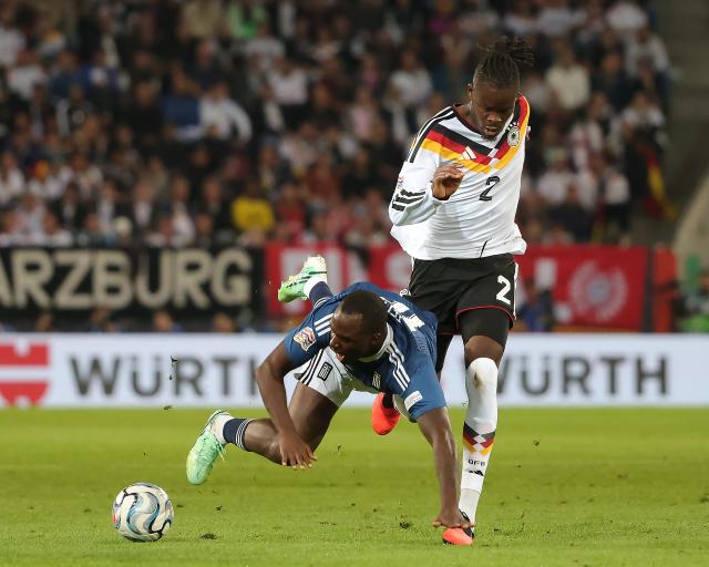 (260928) -- AUGSBURG, Sept. 28, 2026 (Xinhua) -- Yann Bisseck (R) of Germany vies with Andreas Tetteh of Greece during the UEFA Nations League 2026/27 League A Group A match between Germany and Greece in Augsburg, Germany, Sept. 27, 2026. (Photo by Philippe Ruiz/Xinhua)