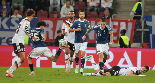 (260928) -- AUGSBURG, Sept. 28, 2026 (Xinhua) -- Players vie for the ball during the UEFA Nations League 2026/27 League A Group A match between Germany and Greece in Augsburg, Germany, Sept. 27, 2026. (Photo by Philippe Ruiz/Xinhua)