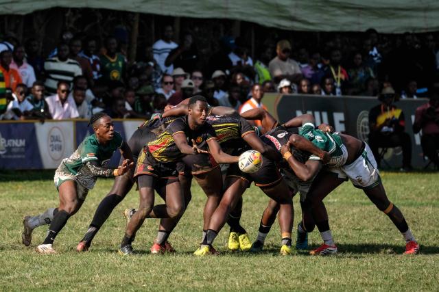 (260928) -- KAMPALA, Sept. 28, 2026 (Xinhua) -- Players of both teams compete during the 2026 Rugby Africa Men's Sevens Series final match between Uganda and Zimbabwe in Kampala, Uganda, on Sept. 27, 2026. (Photo by Hajarah Nalwadda/Xinhua)