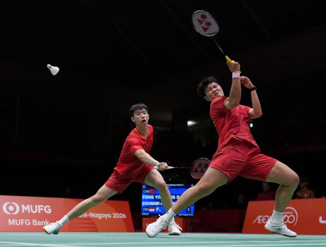 (260928) -- ICHINOMIYA, Sept. 28, 2026 (Xinhua) -- Feng Yanzhe/Huang Dongping (R) of China compete during the mixed doubles semifinals of badminton against Amri Syahnawi/Nita Violina Marwah of Indonesia at the 20th Asian Games Aichi-Nagoya 2026 in Ichinomiya of Aichi Prefecture, Japan, Sept. 28, 2026. (Xinhua/Li Bo)
