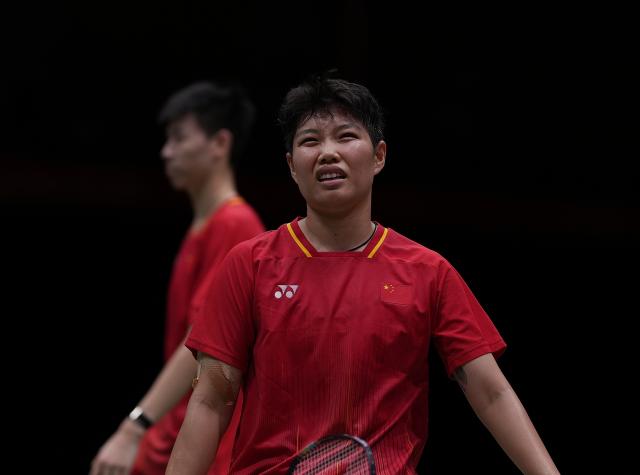 (260928) -- ICHINOMIYA, Sept. 28, 2026 (Xinhua) -- Feng Yanzhe/Huang Dongping (front) of China react during the mixed doubles semifinals of badminton against Amri Syahnawi/Nita Violina Marwah of Indonesia at the 20th Asian Games Aichi-Nagoya 2026 in Ichinomiya of Aichi Prefecture, Japan, Sept. 28, 2026. (Xinhua/Li Bo)