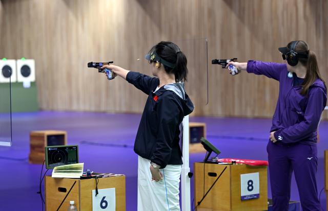 (260928) -- TOYOTA, Sept. 28, 2026 (Xinhua) -- Shang Kaiyan (L) of team China competes during the 25m pistol women team final of shooting at the 20th Asian Games Aichi-Nagoya 2026 in Toyota of Aichi Prefecture, Japan, Sept. 28, 2026. (Xinhua/Liu Lei)