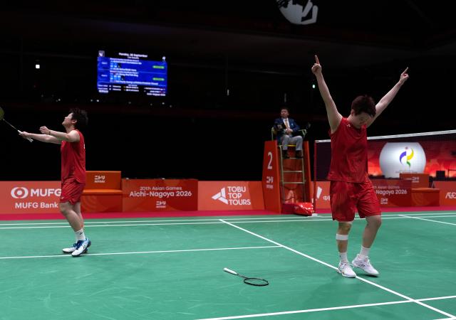 (260928) -- ICHINOMIYA, Sept. 28, 2026 (Xinhua) -- Liu Shengshu (R)/Tan Ning of China celebrate after the women's doubles semifinals of badminton against Tan Pearly Koong Le/Thinaah Muralitharan of Malaysia at the 20th Asian Games Aichi-Nagoya 2026 in Ichinomiya of Aichi Prefecture, Japan, Sept. 28, 2026. (Xinhua/Li Bo)