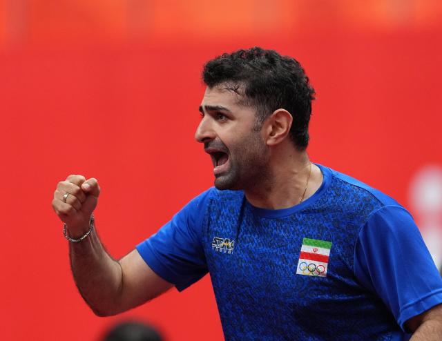 (260928) -- TOYOTA, Sept. 28, 2026 (Xinhua) -- Noshad Alamiyan of Iran celebrates during the men's singles semifinals of table tennis against Wang Chuqin of China at the 20th Asian Games Aichi-Nagoya 2026 in Toyota of Aichi Prefecture, Japan, Sept. 28, 2026. (Xinhua/Cheong Kam Ka)