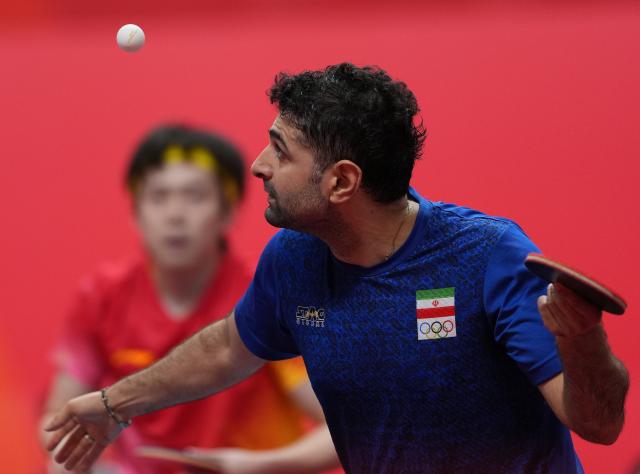 (260928) -- TOYOTA, Sept. 28, 2026 (Xinhua) -- Noshad Alamiyan of Iran competes during the men's singles semifinals of table tennis against Wang Chuqin of China at the 20th Asian Games Aichi-Nagoya 2026 in Toyota of Aichi Prefecture, Japan, Sept. 28, 2026. (Xinhua/Wang Fei)