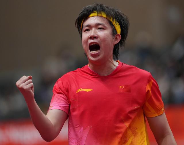 (260928) -- TOYOTA, Sept. 28, 2026 (Xinhua) -- Wang Chuqin of China celebrates during the men's singles semifinals of table tennis against Noshad Alamiyan of Iran at the 20th Asian Games Aichi-Nagoya 2026 in Toyota of Aichi Prefecture, Japan, Sept. 28, 2026. (Xinhua/Cheong Kam Ka)