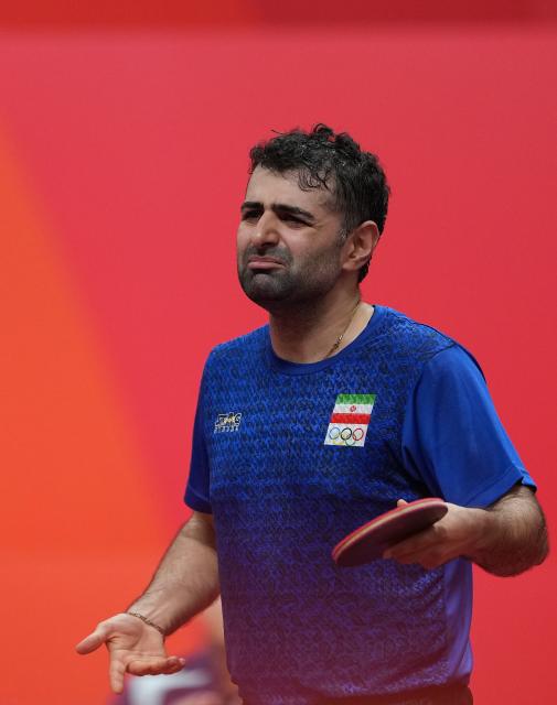 (260928) -- TOYOTA, Sept. 28, 2026 (Xinhua) -- Noshad Alamiyan of Iran reacts during the men's singles semifinals of table tennis against Wang Chuqin of China at the 20th Asian Games Aichi-Nagoya 2026 in Toyota of Aichi Prefecture, Japan, Sept. 28, 2026. (Xinhua/Wang Fei)
