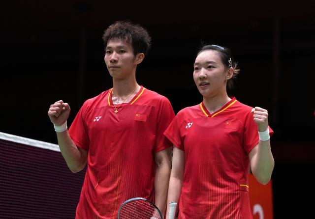 (260928) -- ICHINOMIYA, Sept. 28, 2026 (Xinhua) -- Jiang Zhenbang (L)/Wei Yaxin of China pose for photos after the mixed doubles semifinals of badminton against Ye Hong-wei/Chan Nicole Gonzales of Chinese Taipei at the 20th Asian Games Aichi-Nagoya 2026 in Ichinomiya of Aichi Prefecture, Japan, Sept. 28, 2026. (Xinhua/Li Bo)