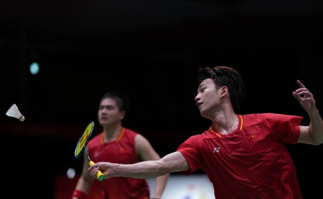 (260928) -- ICHINOMIYA, Sept. 28, 2026 (Xinhua) -- Liang Weikeng/Wang Chang (front) of China compete during the men's doubles semifinals of badminton against Fajar Alfian/Muhammad Shohibul Fikri of Indonesia at the 20th Asian Games Aichi-Nagoya 2026 in Ichinomiya of Aichi Prefecture, Japan, Sept. 28, 2026. (Xinhua/Li Bo)