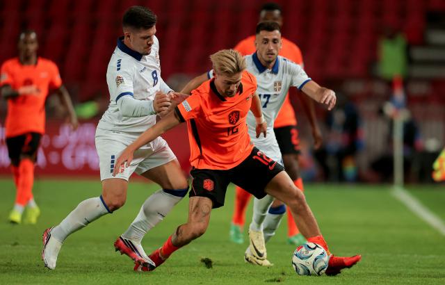 (260928) -- BELGRADE, Sept. 28, 2026 (Xinhua) -- The Netherlands' Kenneth Taylor (C) vies with Serbia's Luka Jovic (L) during the UEFA Nations League 2026/27 League A Group A match between Serbia and the Netherlands in Belgrade, Serbia, Sept. 27, 2026. (Photo by Predrag Milosavljevic/Xinhua)